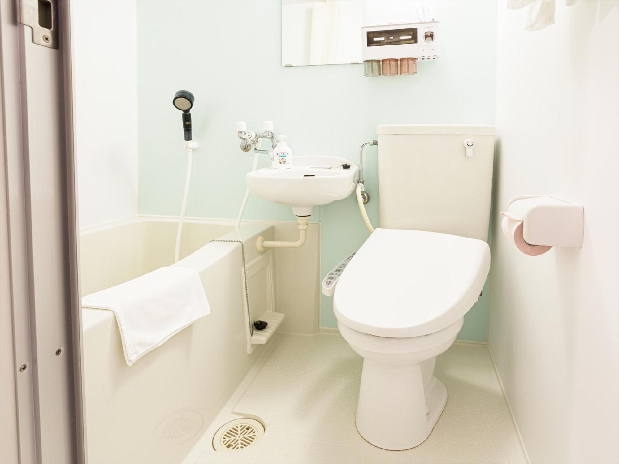かりゆしコンドミニアムリゾート那覇スカイリビングホテル旭橋駅前 Naha Zimmer foto