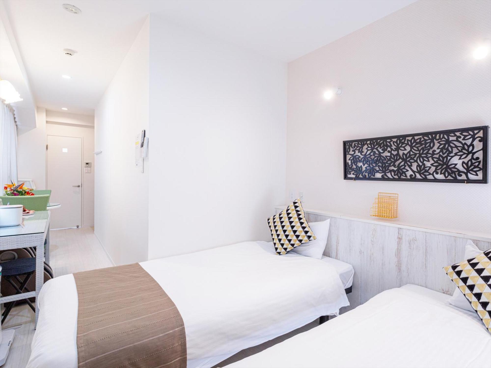 かりゆしコンドミニアムリゾート那覇スカイリビングホテル旭橋駅前 Naha Zimmer foto
